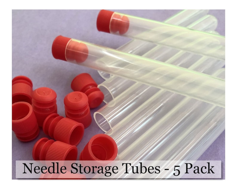 May include: Clear plastic needle storage tubes with red caps. The image shows several tubes, some with caps on and some with caps off. The text "Needle Storage Tubes - 5 Pack" is at the bottom of the image.