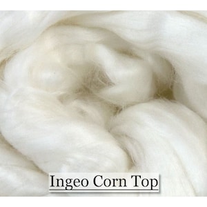May include: Close-up of a pile of soft, white fiber. The fibers are tightly packed and appear fluffy. The text "Ingeo Corn Top" is displayed in a white box at the bottom of the image. The fibers have a natural, organic appearance.