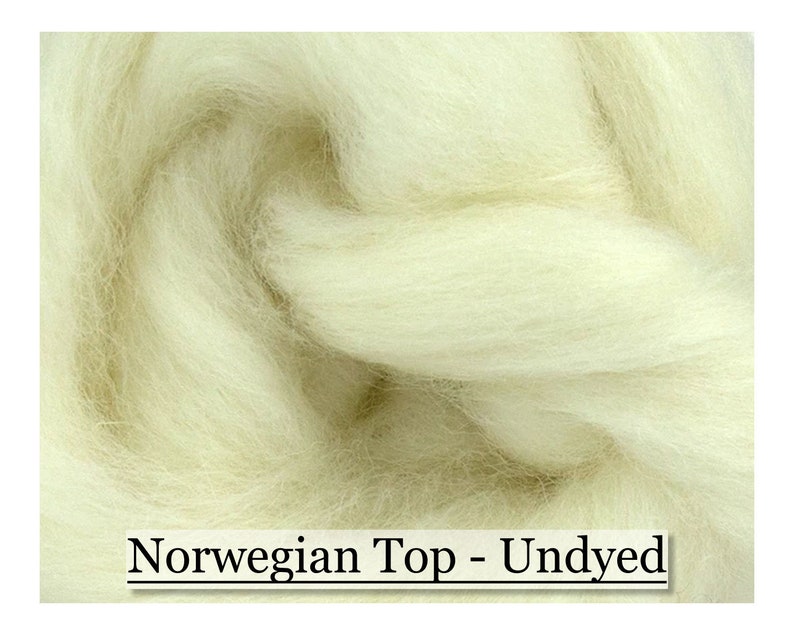 May include: Close-up of undyed Norwegian Top wool fibers. The fibers are a creamy off-white color, tightly packed, and appear soft and fluffy. The text "Norwegian Top - Undyed" is displayed at the bottom of the image.