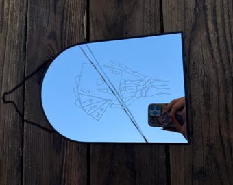 Mirror etching of a Skeleton hand with playing cards
