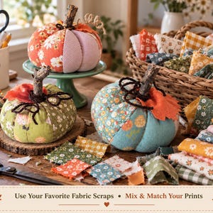 May include: Three fabric pumpkins with twig stems, featuring assorted floral and gingham patterns in orange, green, and blue. The text reads: Use Your Favorite Fabric Scraps &bull; Mix & Match Your Prints. Includes sewing supplies and fabric scraps.
