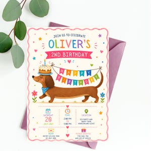 May include: A rectangular birthday invitation card with a scalloped pink border featuring a brown dachshund wearing a blue bandana and a birthday cake on its head. The text reads JOIN US TO CELEBRATE OLIVER'S 2ND BIRTHDAY and includes party details.