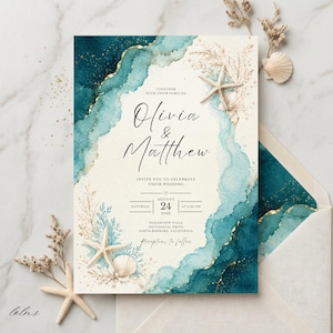May include: A wedding invitation card featuring a teal and dark blue watercolor wash with gold accents, starfish, and seashells. The text reads: Together with their families, Olivia & Matthew, invite you to celebrate their wedding, August 24, 2026.