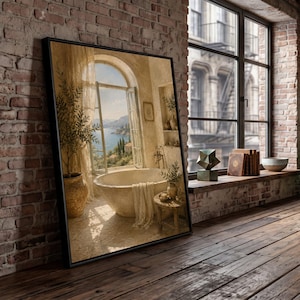 May include: A framed wall art print depicting a bathroom scene with a stone bathtub, a potted olive tree, and an open arched window overlooking a coastal landscape. The artwork features warm, neutral tones and a detailed interior setting.