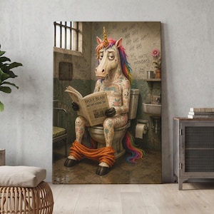 May include: A wall art print depicting a tattooed unicorn with a rainbow mane sitting on a toilet, reading a newspaper titled Daily Blah Another Boring Day. The wall features tally marks and the text I Hate Mondays with a skull and crossbones.