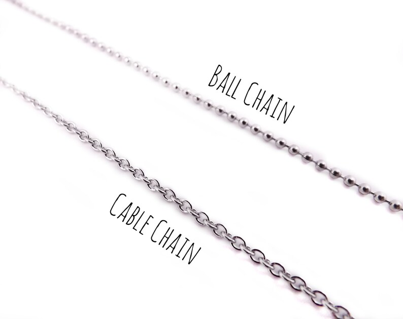 May include: Two silver chains, one labeled "Cable Chain" and the other labeled "Ball Chain".