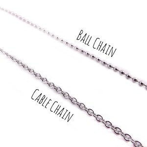 May include: Two silver chains, one labeled "Cable Chain" and the other labeled "Ball Chain".