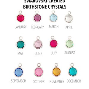 May include: Twelve round Swarovski-created birthstone crystals in silver settings. Each crystal represents a different month of the year. The crystals are arranged in three rows of four. The crystals are red, pink, light blue, clear, teal, light pink, red, light green, light blue, pink, gold, and teal.