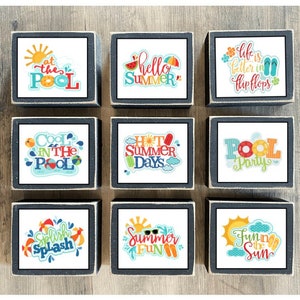 May include: Nine wooden blocks with summer-themed designs. The blocks feature phrases like "At the Pool", "Hello Summer", "Life is Better in Flip Flops", "Cool in the Pool", "Hot Summer Days", "Pool Party", "Splish Splash", "Summer Fun", and "Fun in the Sun".