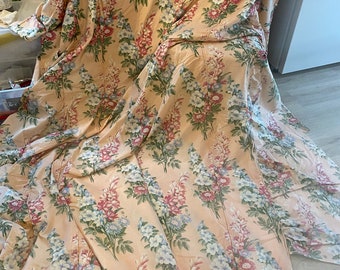 Gorgeous vintage pinkish peach and blue floral fabric bed cover, shabby distressed fabric from the 40s or early 50s, vintage flowered fabric