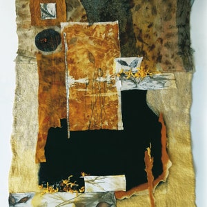 May include: Abstract art piece made with fabric scraps in shades of brown, yellow, and black. The fabric is layered and stitched together to create a textured and dimensional surface.