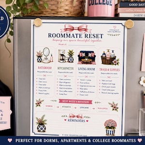 May include: A Roommate Reset chore chart printable PDF featuring a white background with pink and navy blue text and graphics. The chart includes sections for bathroom, kitchenette, living room, and trash tasks, with a rotation schedule and a reminders area.