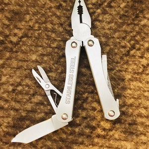 Vintage multi functional tool. MASTERGRIP tm. Stainless steel handy little tool to carry in purse or pocket