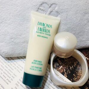 Diamonds and Emeralds perfumed body lotion, white velour cosmetic bag and L’Oréal defence eye creme and lucite bangle set