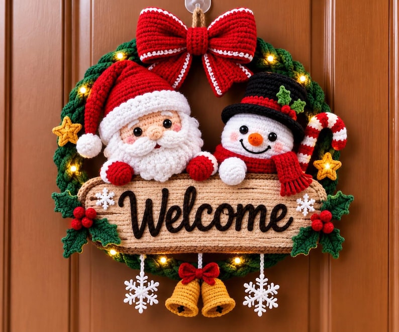May include: A crocheted Christmas wreath featuring a Santa Claus and a snowman, a large red bow at the top, and a central sign with the text Welcome. The wreath is decorated with small yellow stars, holly leaves, red berries, and two hanging bells.