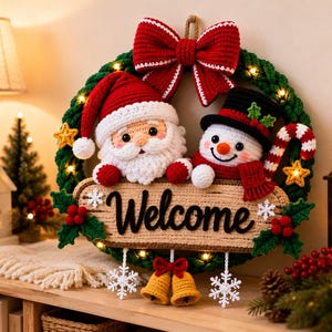 May include: A round green crochet wreath featuring a large red bow at the top, a Santa Claus figure, and a snowman figure. A tan sign with the word Welcome is centered, decorated with red berries and white snowflakes. Two yellow bells hang below.