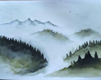May include: A watercolor painting depicting a misty mountain landscape with dark green pine trees in the foreground and hazy blue mountain peaks in the distance. Two small birds are visible in the pale sky above the fog-covered hills.