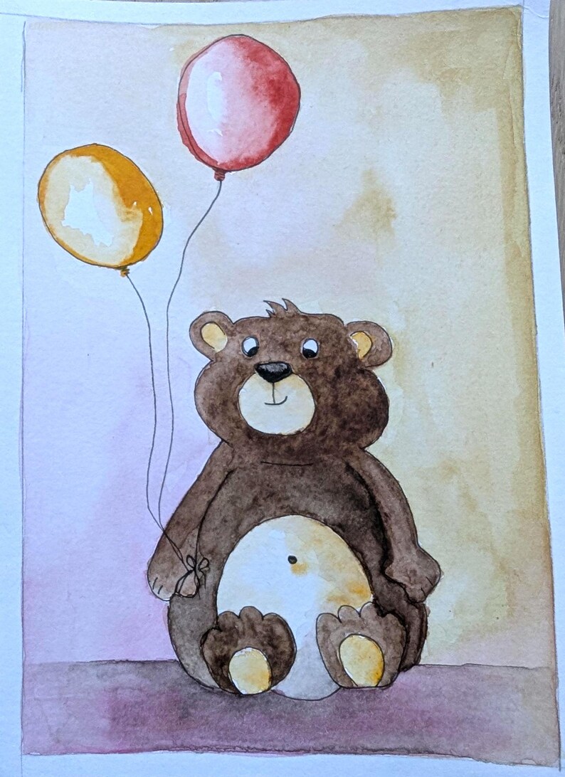 May include: A watercolor painting of a brown teddy bear with a cream-colored belly, sitting upright and holding two balloons. One balloon is red and the other is yellow. The bear has dark brown fur, a black nose, and a small dot on its belly.