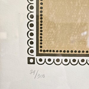 May include: A black and white print with a brown border and the number 79/300 in the bottom right corner.
