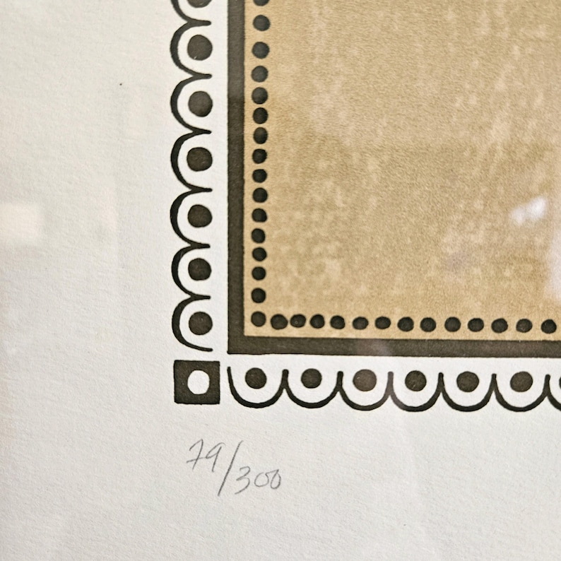 May include: A black and white print with a brown border and the number 79/300 in the bottom right corner.