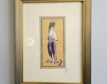May include: A framed print of a woman in a colourful, patterned dress and a turban. The background is a gold mosaic pattern.