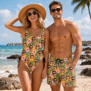May include: A one-piece swimsuit and swim trunks featuring a repeating pattern of tropical green palm leaves, pink hibiscus flowers, and a custom photo of a face wearing black sunglasses. The swimwear set displays a vibrant yellow background.