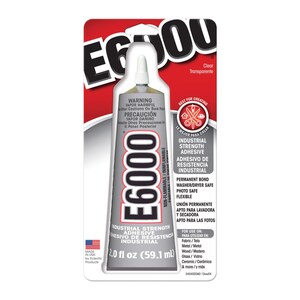 May include: E6000 industrial strength adhesive in a clear, 59.1 ml tube. The tube is silver with black and white text, including warnings and usage instructions. The packaging features a red and white design with the words "Best for Creating."