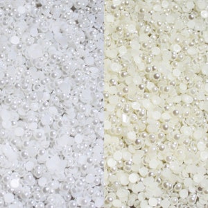 May include: Two close-up images of white pearl beads. The beads are various sizes and shapes, some are round and some are flat. The beads are arranged in a random pattern.