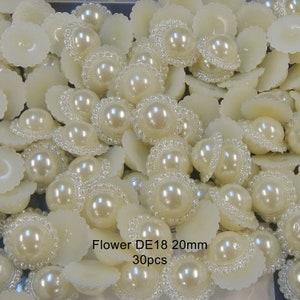 May include: A close-up of a group of 30 white pearl embellishments with a decorative border. Each pearl is approximately 20mm in diameter. The text "Flower DE18 20mm 30pcs" is visible in the image.