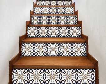 May include: A set of decorative stair treads with a geometric pattern in shades of blue, white, and gold. The treads are made of a durable material and are easy to apply.