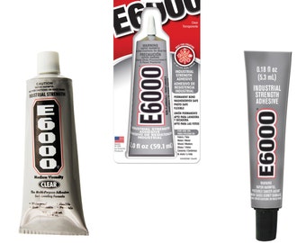 May include: Three tubes of E6000 industrial strength adhesive. The tubes are silver and gray with black text. One tube is on a red and white backing. The adhesive is clear and multi-purpose.