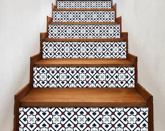 May include: A set of five stair treads with a decorative blue and white geometric pattern. The pattern features a repeating design of hearts and squares with red accents.