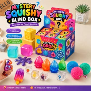 May include: A Mystery Squishy Blind Box display container with colorful graphics and text, surrounded by various squishy fidget toys including translucent cubes, fruit-themed cubes, a purple splat, a popsicle, and textured spheres in pink, blue, and green.