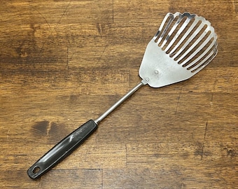 Vintage Kitchamajig, Stainless Steel with Black Handle, “Lifts Mixes Whips Mashes Crushes Strains”