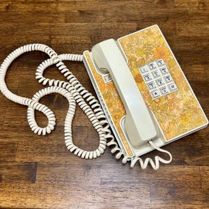 May include: A set of three ceramic mugs with a speckled, matte finish. The mugs are in shades of cream, light gray, and dark gray. Each mug has a simple, minimalist design and a rounded handle.