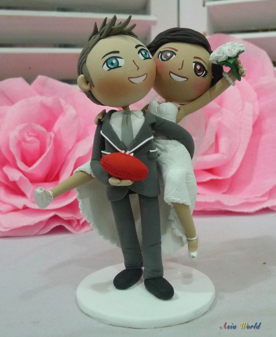 Wedding cake topper Groom carry bride on back hold football | Etsy