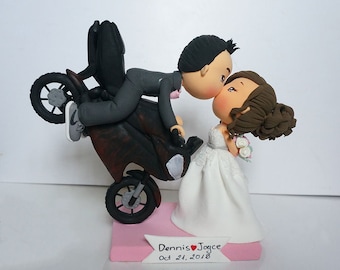 Kissing couple with dirt bike wedding cake topper clay doll, rear wheel hop pose clay miniature, engagement decoration clay figurine