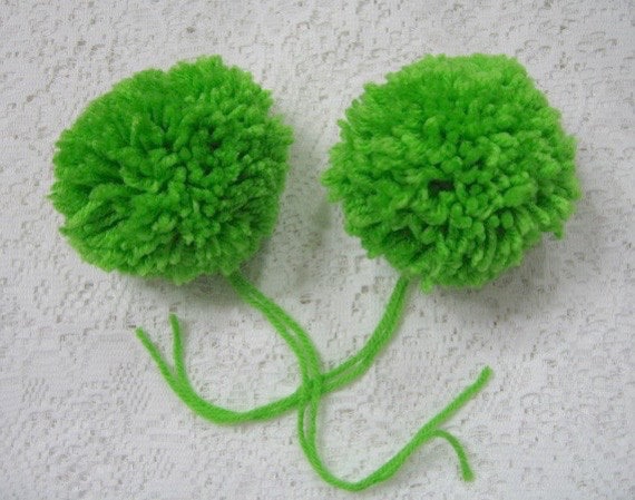 green yarn pom poms