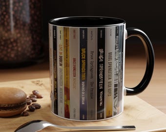 Taza con diseño de la colección de álbumes en CD de Bruce Springsteen.