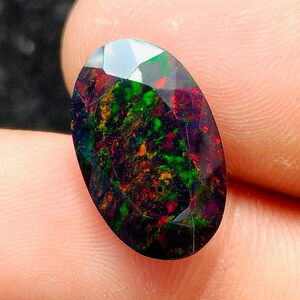 4.70 CT Ethiopian Black Opal, Faceted Oval Gemstone, Neon Green Red Fire Flash.