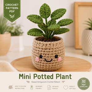 May include: A crochet pattern PDF for a mini potted plant. The image shows a small, green, crocheted plant with multiple leaves in a beige, crocheted pot featuring a smiling face with black eyes, a black mouth, and pink cheeks.