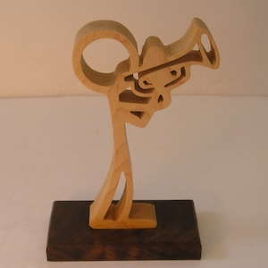 stick figure trumpet or coronet player.  scroll saw cut, sculpture.  Musical figurine.