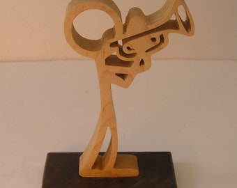 stick figure trumpet or coronet player.  scroll saw cut, sculpture.  Musical figurine.