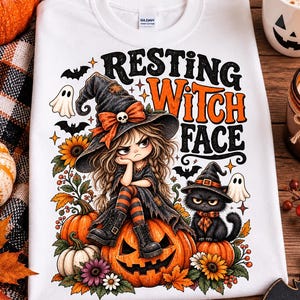 May include: A white t-shirt featuring a graphic of a girl in a witch hat sitting on a pumpkin with the text Resting Witch Face. The design includes a black cat in a witch hat, ghosts, bats, sunflowers, and autumn leaves in orange and purple.
