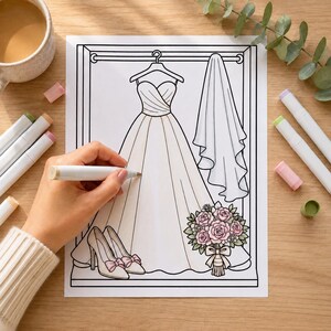 May include: A colouring page featuring a line art illustration of a strapless wedding gown on a hanger, a hanging veil, a pair of high-heeled shoes with bows, and a bouquet of roses. The bouquet is partially coloured in shades of pink and green.