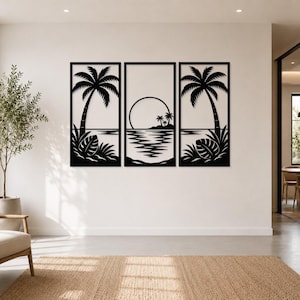 May include: A three-piece black metal wall art set featuring a tropical beach scene. Each rectangular panel displays a silhouette of a palm tree, foliage, and a sunset over the ocean, creating a continuous coastal landscape across the wall.