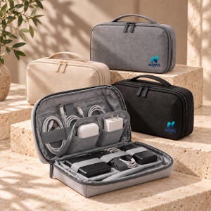 May include: A collection of rectangular travel organizer cases in gray, beige, and black. One gray case is open, revealing internal elastic straps and pockets holding white charging cables, a white power adapter, and black electronic devices.