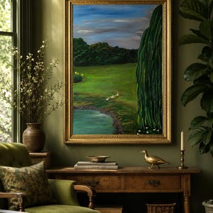 May include: A framed oil painting depicting a landscape with a green meadow, a small pond, three white ducks, and a large willow tree under a blue sky with clouds. The artwork is enclosed in a decorative gold-toned frame with ornate detailing.