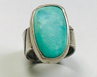 Sky blue turquoise ring with fused leaf sterling silver band.