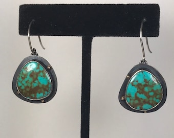 Turquoise, silver and gold earrings.